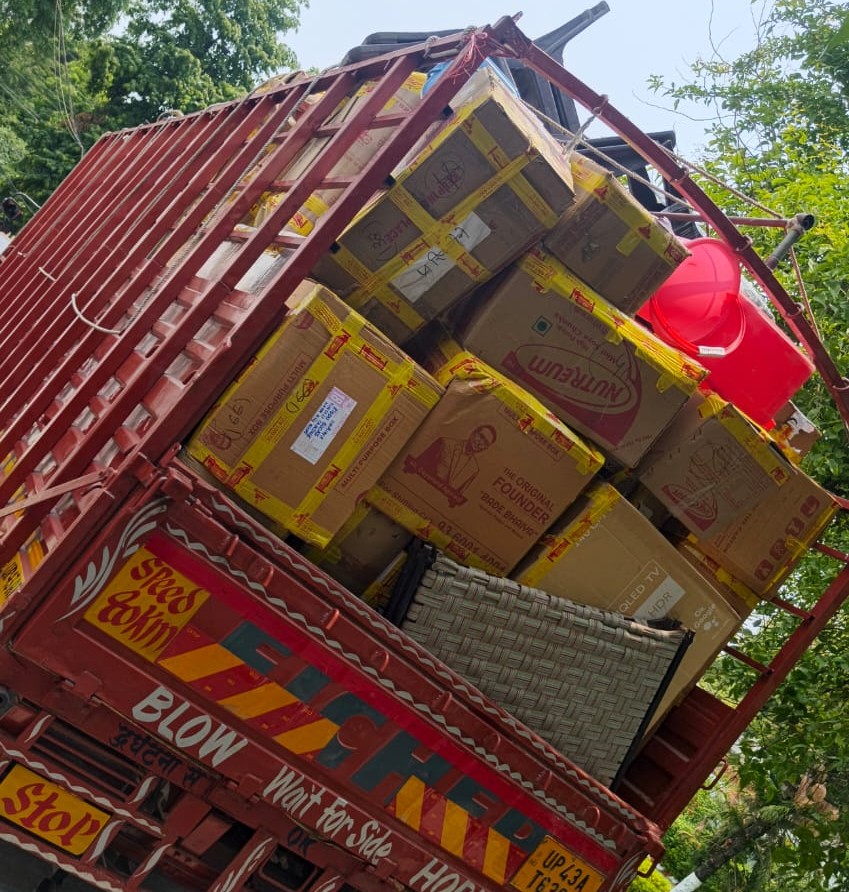 Cardboard boxes and tape roll